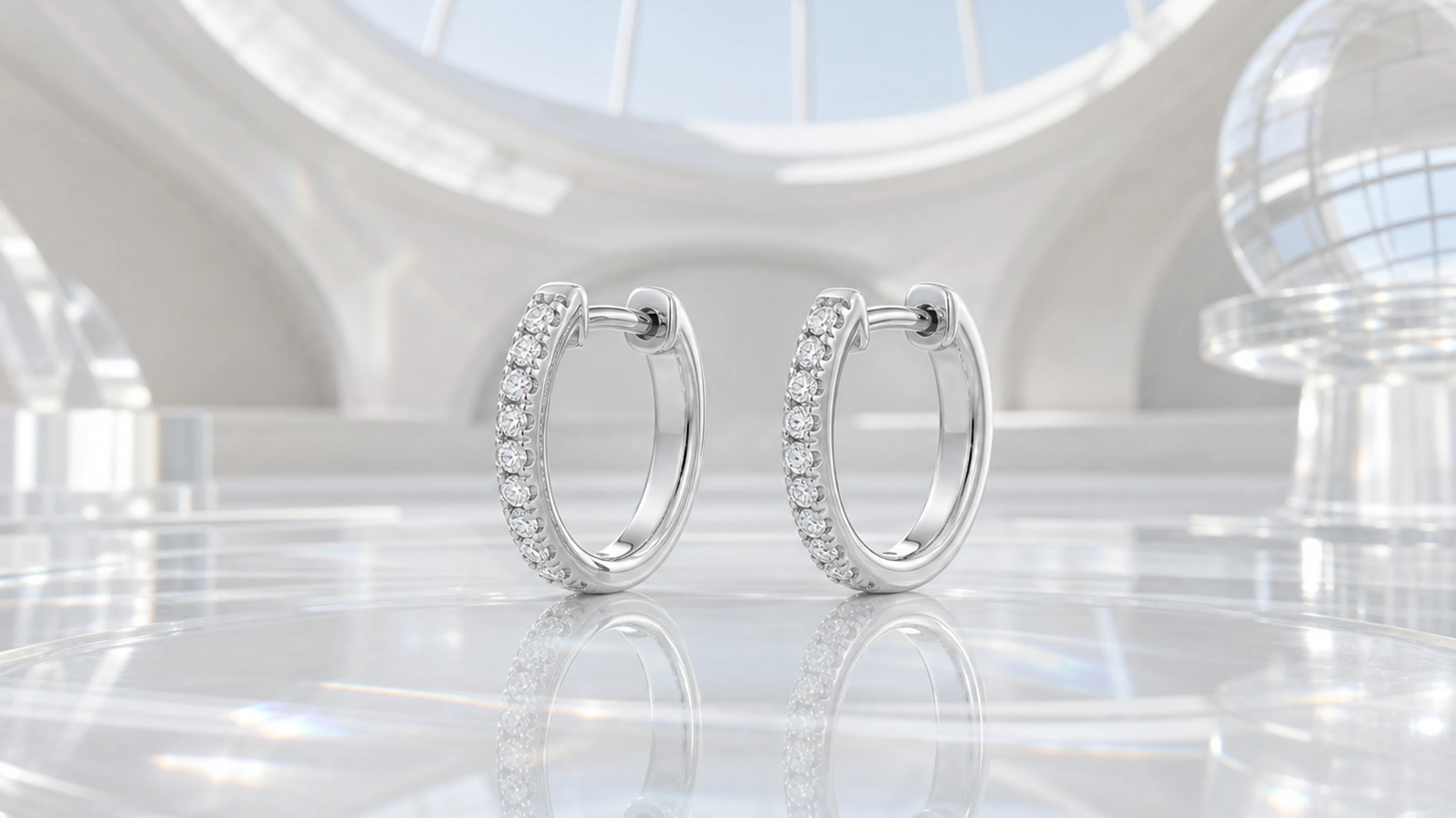 Pair of platinum diamond arc hoop earrings