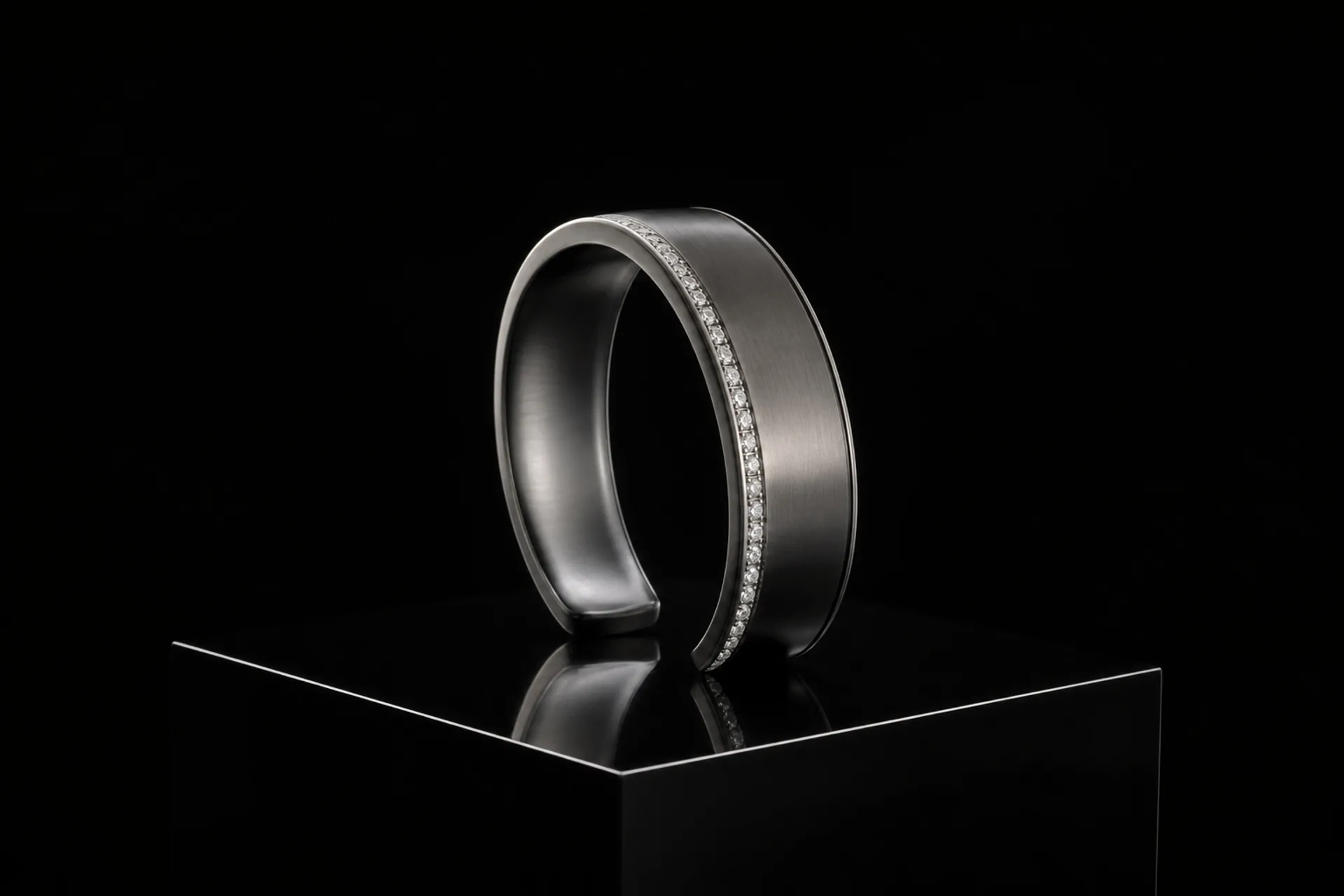 Blackened-platinum open cuff with a channel of white diamonds