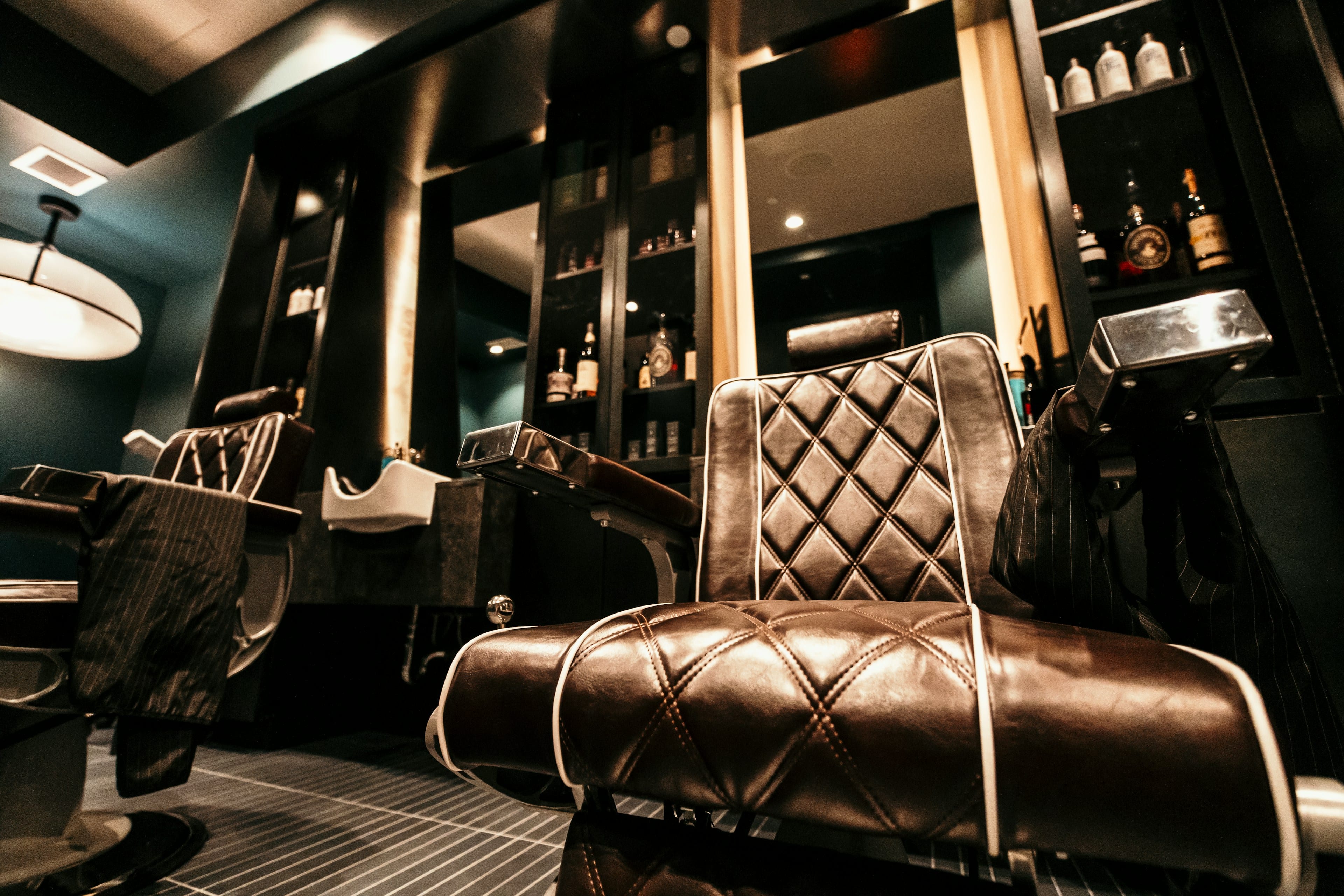 Barber chair and mirror inside a barbershop