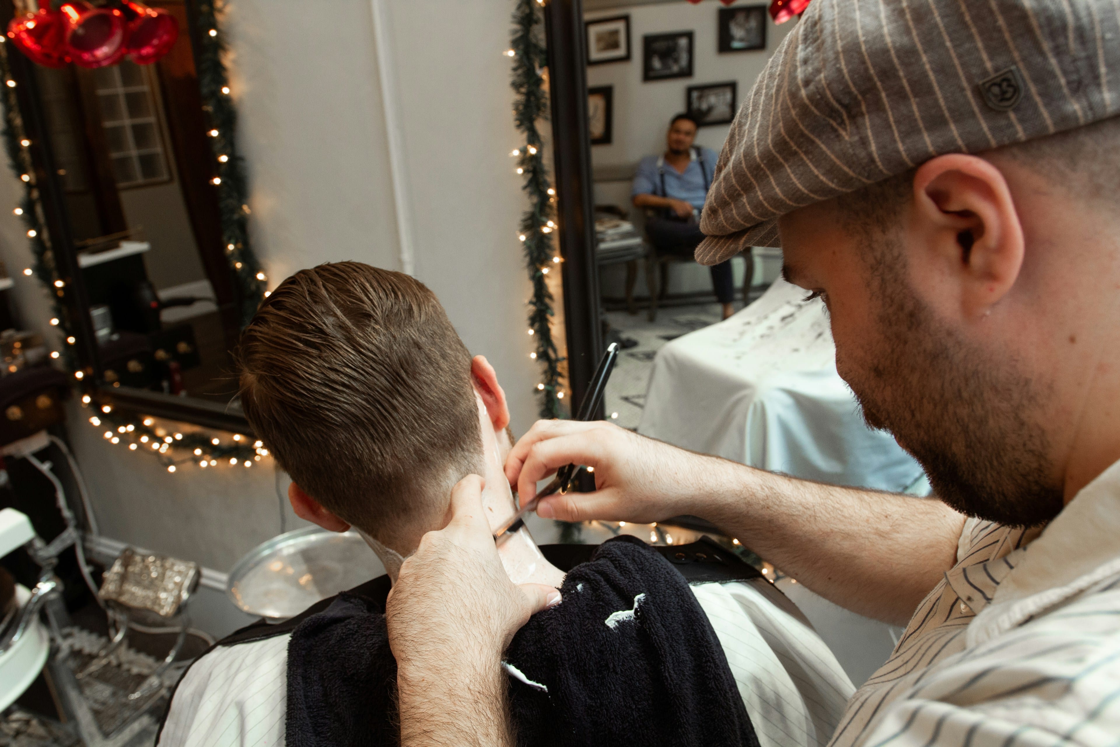 Man getting a fade haircut in a barbershop